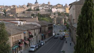 A street view with buildings, cars, and a VAP sign.