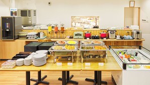 A buffet setup with various food stations and a coffee machine. - Hotel Peace Island Naha (Naha)