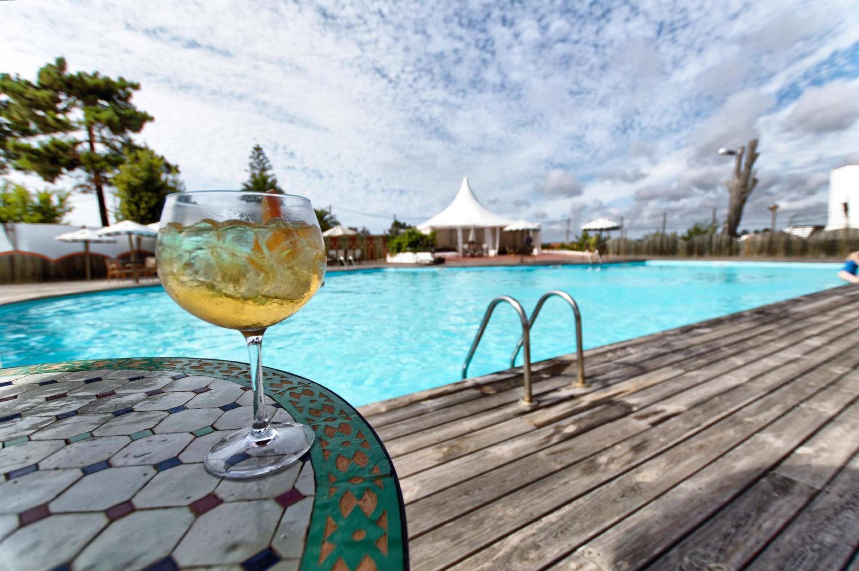 outdoor pool, pool umbrellas, pool loungers