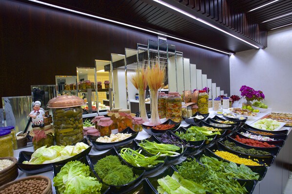 A buffet with various food items and condiments. - The Hotel Beyaz Saray - Grand Bazaar (Istanbul)