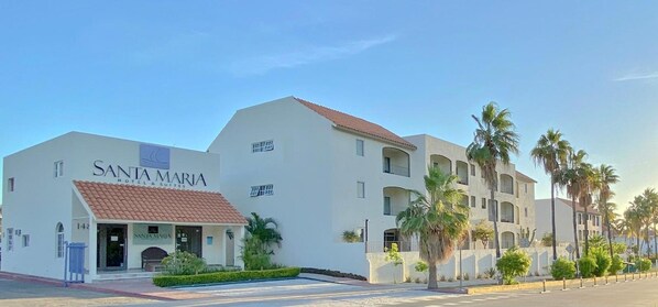 A hotel named 'SANTA MARIA HOTEL & SUITES' with a white facade, red-tiled roof, and multiple balconies. - Santa Maria del Cabo (San José del Cabo)