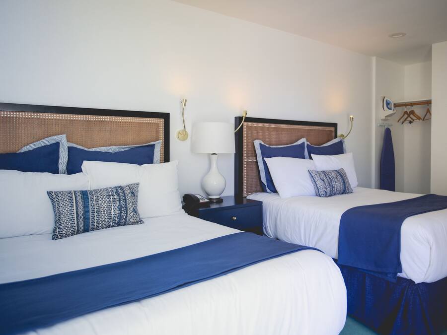 Premium bedding, down duvets, blackout curtains, iron/ironing board