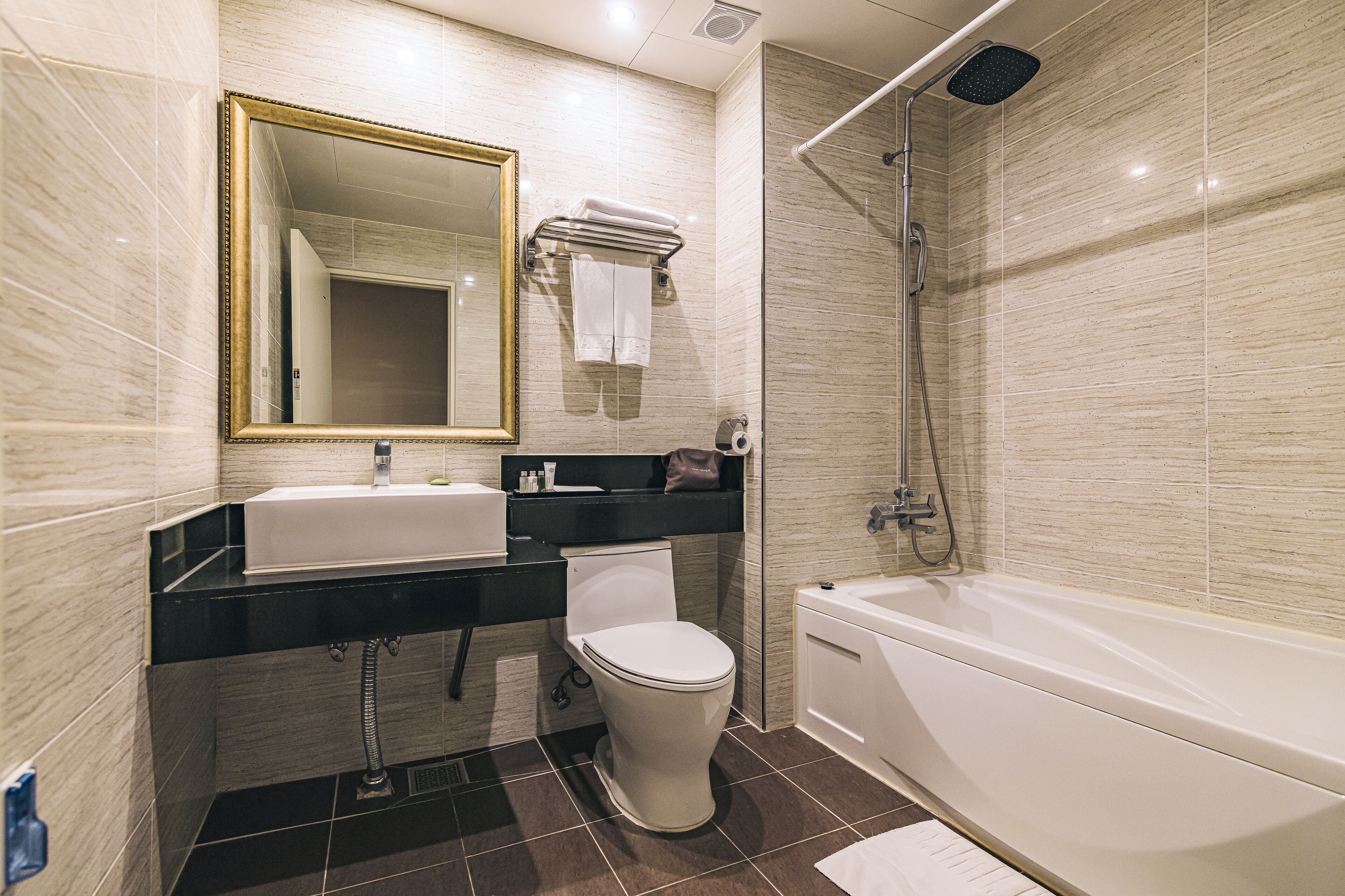 separate bathtub and shower, deep-soaking bathtub, hair dryer, slippers