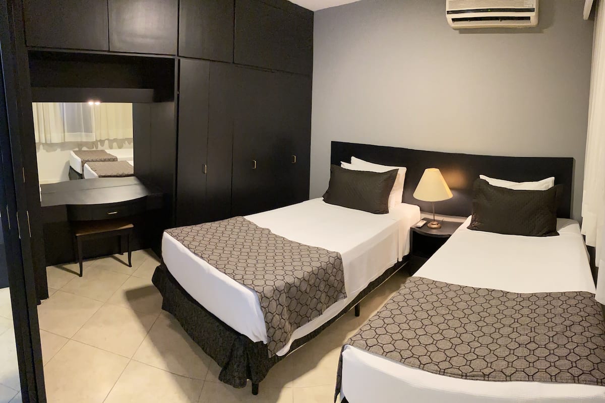 Executivo Solteiro | 1 bedroom, minibar, in-room safe, blackout curtains