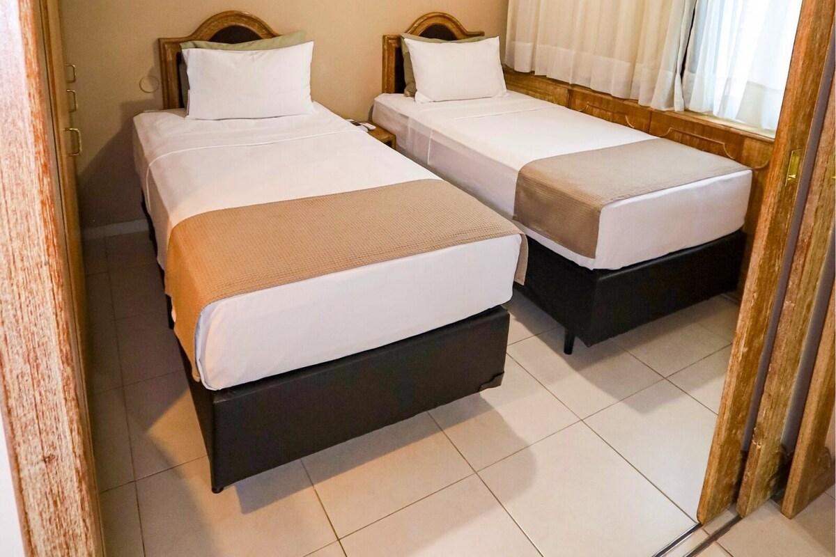 Standard Solteiro | 1 habitación, minibar y caja de seguridad en la habitación 