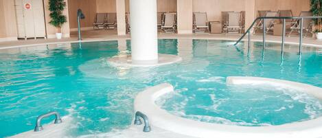 Indoor pool, seasonal outdoor pool, pool umbrellas, pool loungers