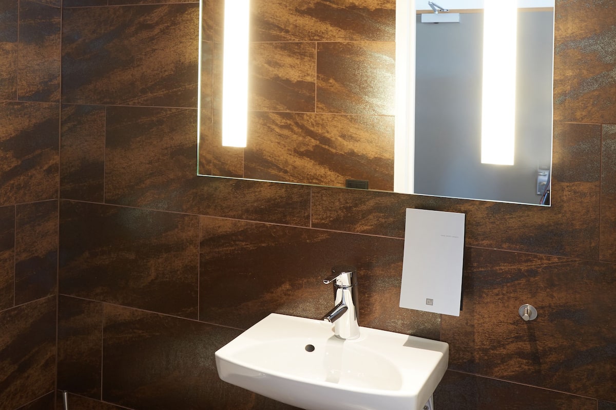 suite | bathroom | shower, hair dryer, towels