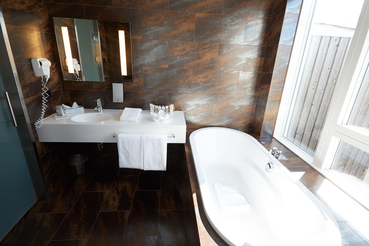 suite | bathroom | shower, hair dryer, towels