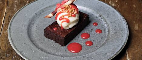 A dessert on a plate with a wooden background.