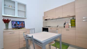 Family Condo, 2 Bedrooms, Private Pool, Garden View (Località Piricone) | Private kitchenette | Full-size fridge, cookware/dishes/utensils