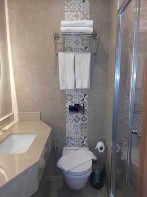 Shower, free toiletries, hair dryer, slippers