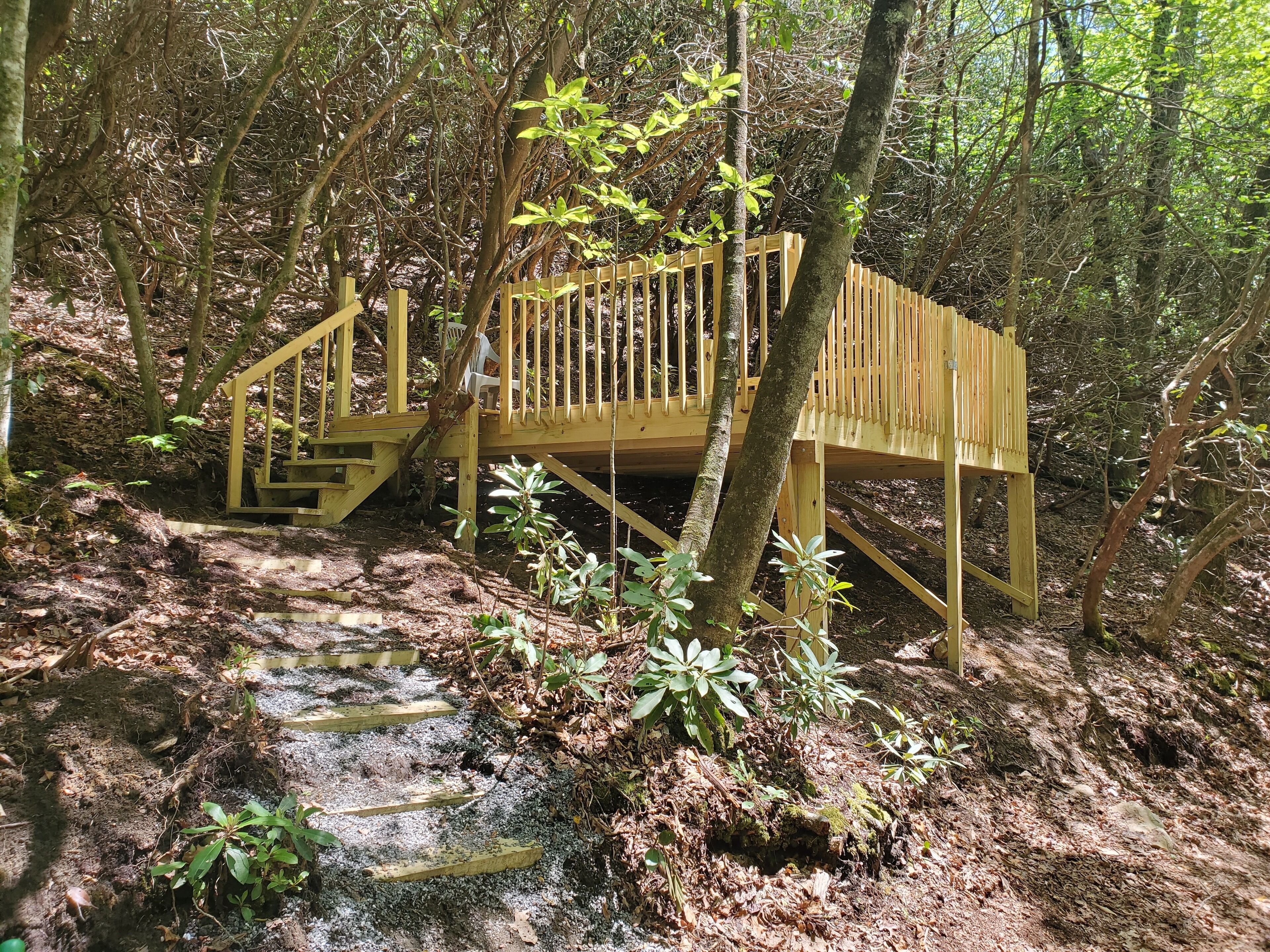 Hillside Deck Tent Camping on private wooded property.