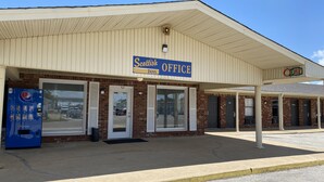 A Scottish Office building with a sign indicating it's open. - Scottish Inns Jonesboro AR  (Jonesboro)