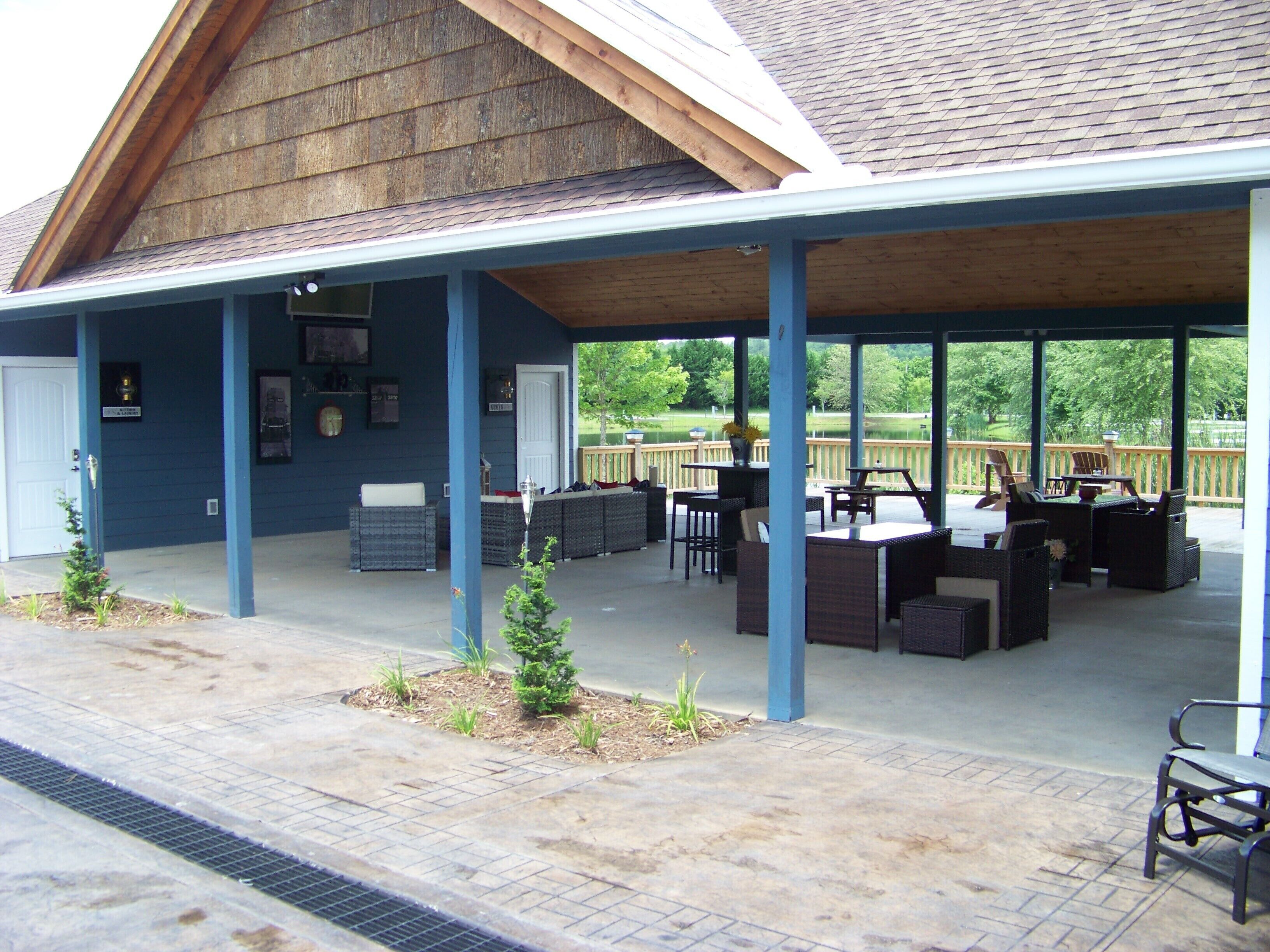 An outdoor patio area with seating and a covered section.