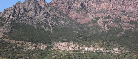 A mountainous landscape with a town nestled in the valley.