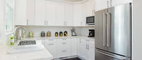 Electric kettle, spices, ice maker, dining tables