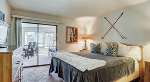 Relax in comfort with a large bed, a desk for work, and a balcony with a view.