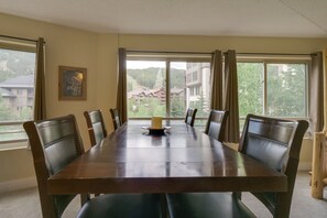 Enjoy meals with friends and family in this spacious dining area, surrounded by a serene mountain view.
