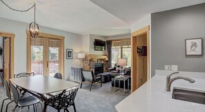 Cozy dining and living areas with a kitchen, perfect for relaxing and socializing.