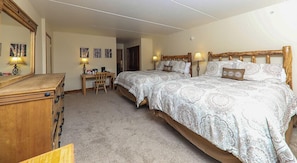 Cozy retreat with a large bed, bedside tables, and a dresser.
