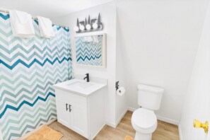 Bathtub, hair dryer, towels, soap