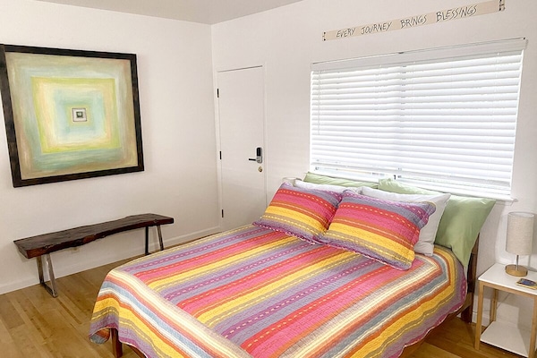 Lower level bedroom with queen bed.