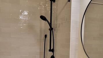 Combined shower/bathtub, hair dryer, towels, soap