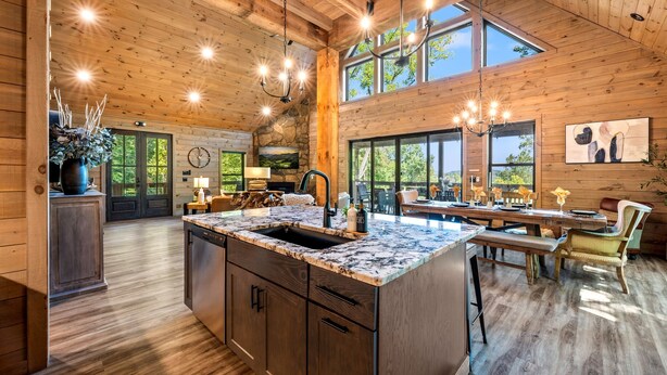 A spacious kitchen with a large island, wooden ceiling, and large windows. - Playground|Views|Pets |Pool |Sauna |Massage Chair (Sevierville)