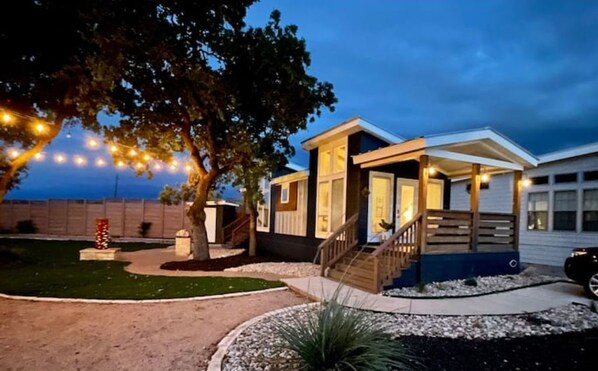 Welcome to this charming two-story home with a cozy front porch and a beautifully manicured lawn.