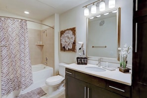 Combined shower/bathtub, hair dryer, towels, soap