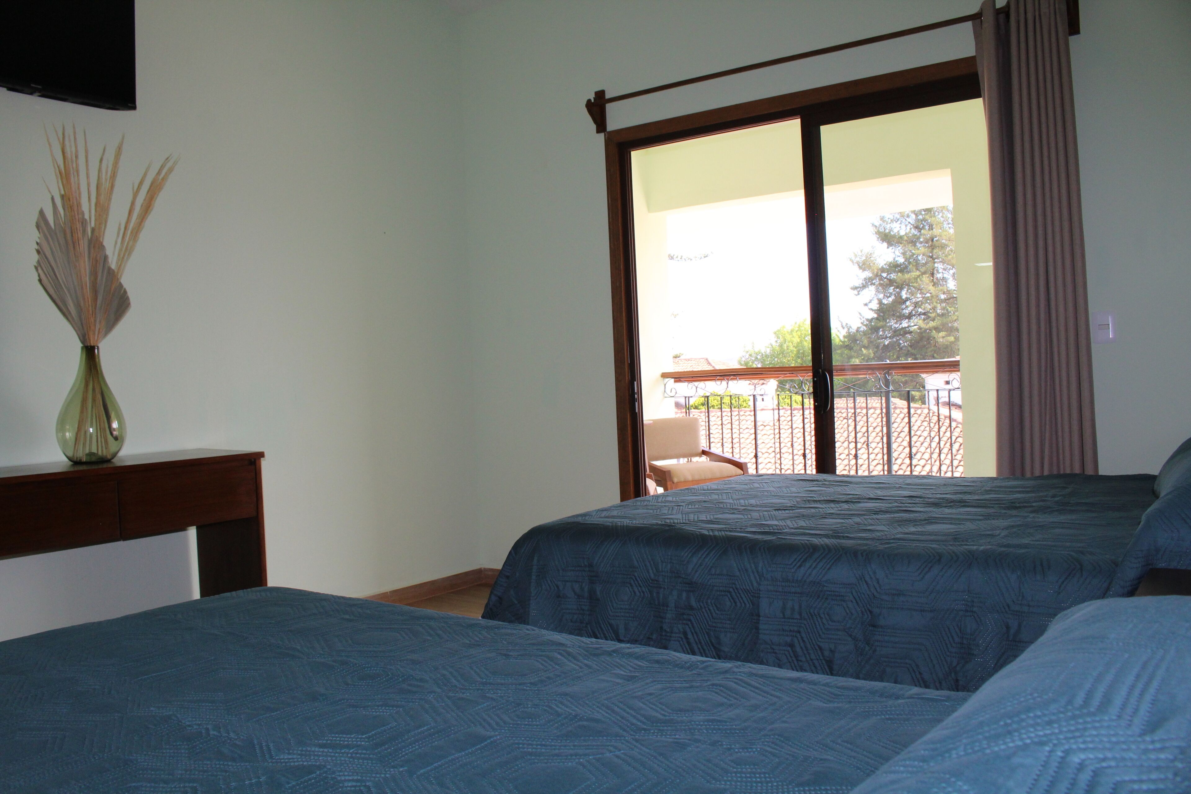 family room, 2 double beds, city view | down duvets, desk, free wifi