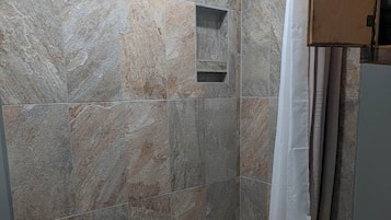Shower, hair dryer, towels, toilet paper
