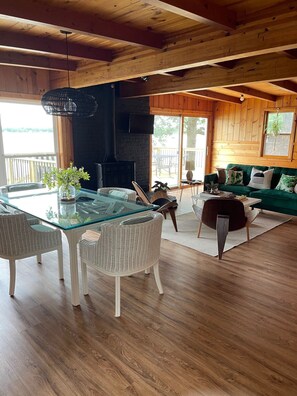 Relax in this inviting space with a glass-top dining table and comfortable sofa, perfect for unwinding.