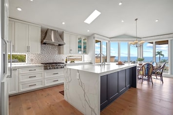 Large waterfall island and breakfast table that seats 6