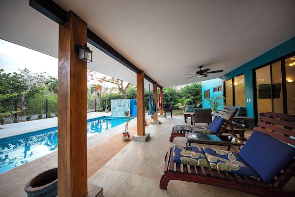 Beautiful patio, pool, and loungers for days of relaxing