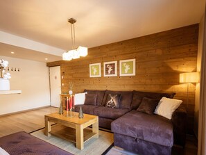 Cozy living room with a comfortable sofa and simple decor.