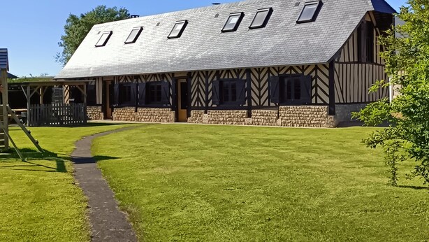 A building with a sloped roof, stone foundation, and timber framing. - LONGERE NEAR HONFLEUR, DEAUVILLE, LE HAVRE (Beuzeville)