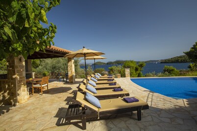 Private waterfront villa with pool and two private beaches