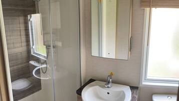 Shower, hair dryer, towels, toilet paper