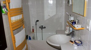 Bathtub, hair dryer, towels