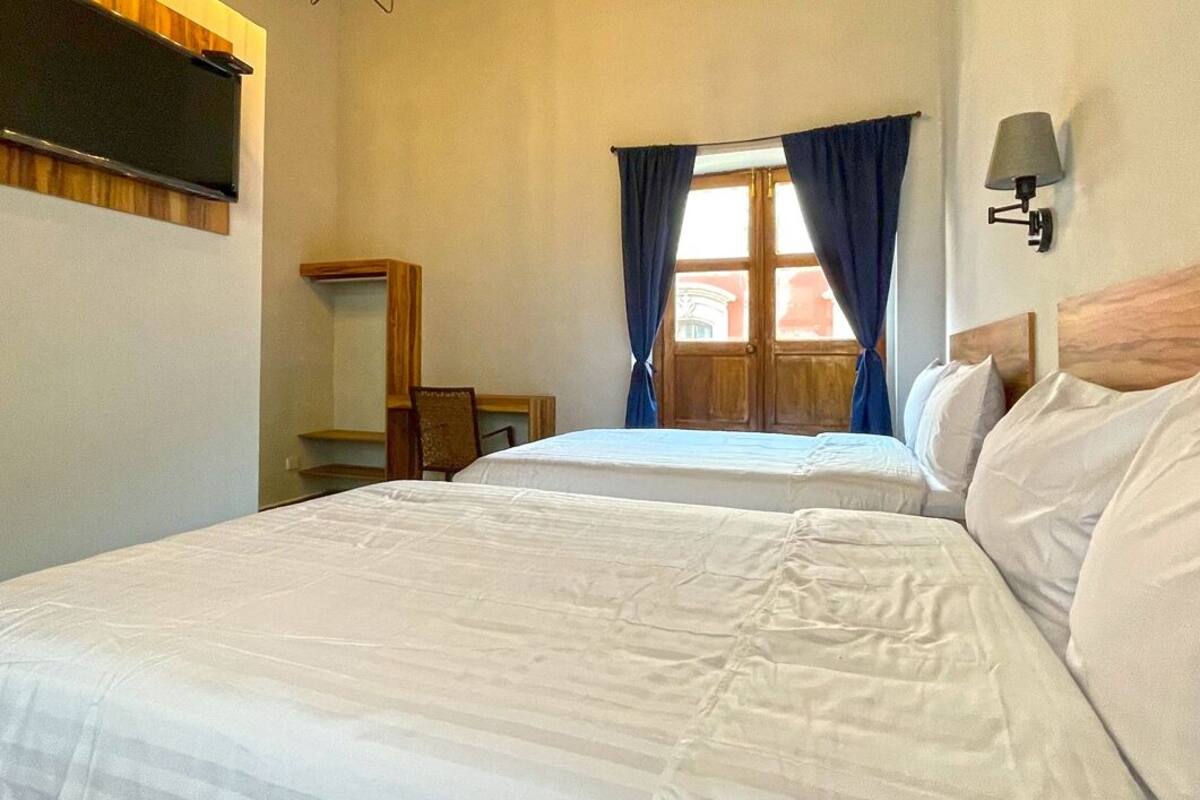 Desk, laptop workspace, free WiFi, bed sheets