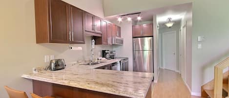 Comfort Condo | Private kitchen | Full-size fridge, microwave, oven, dishwasher