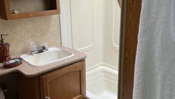 Combined shower/tub, towels, soap, shampoo