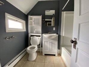Combined shower/tub, towels, soap, toilet paper