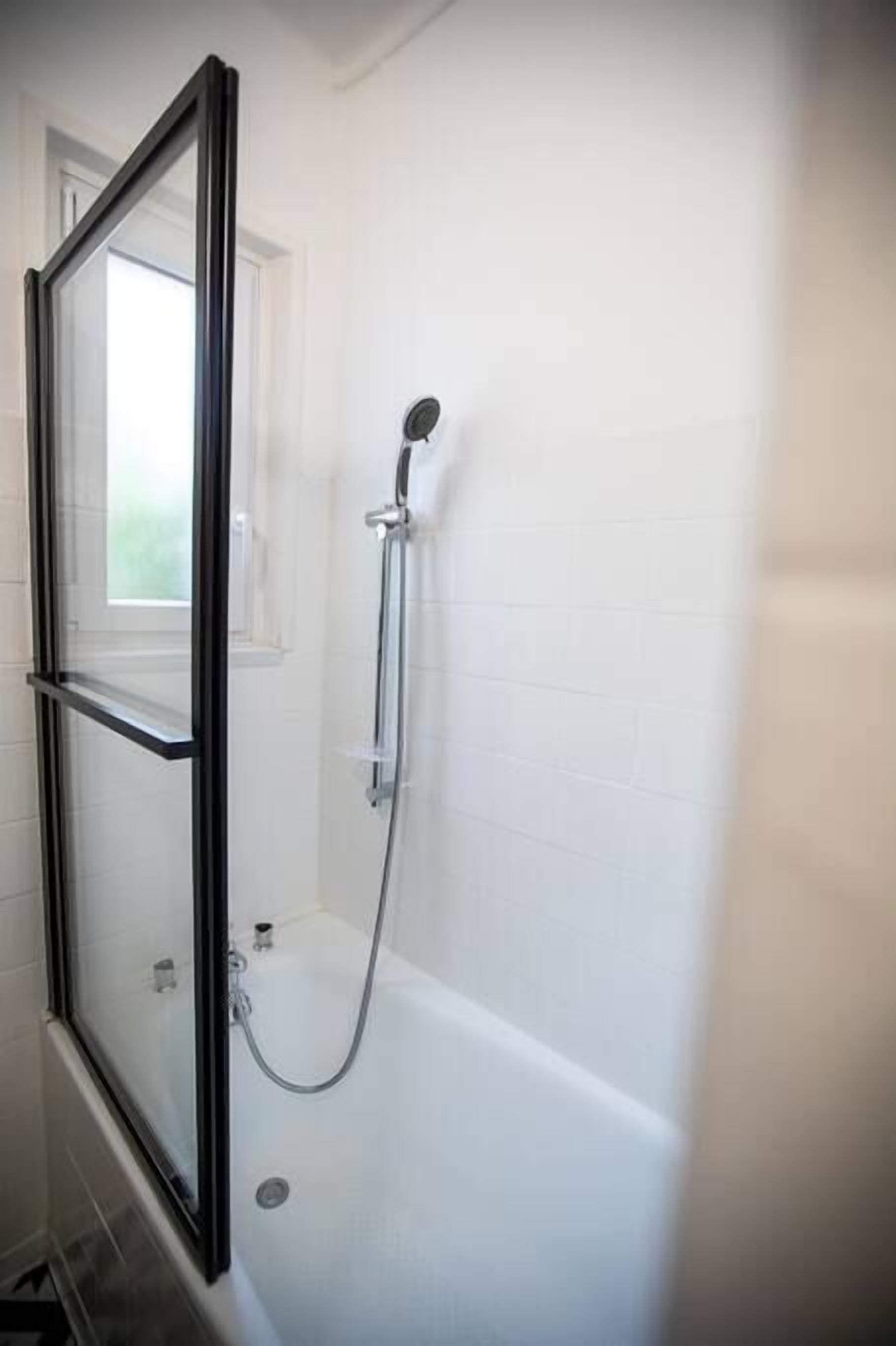 Bathtub, hair dryer, towels, soap