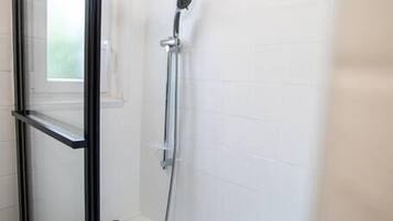 Bathtub, hair dryer, towels, soap
