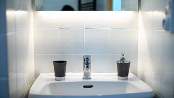 Bathtub, hair dryer, towels, soap