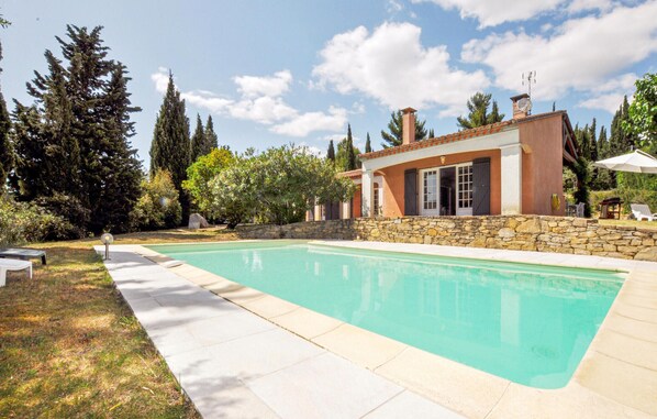 Relax by the serene pool surrounded by lush gardens and mature trees.