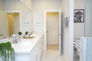 Combined shower/tub, hair dryer, towels, soap
