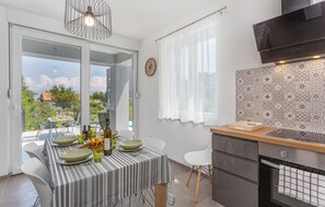 Fridge, stovetop, dishwasher, coffee/tea maker